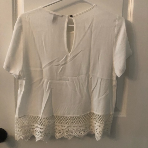 White blouse t-shirt with lace on the bottom. - Picture 2 of 3